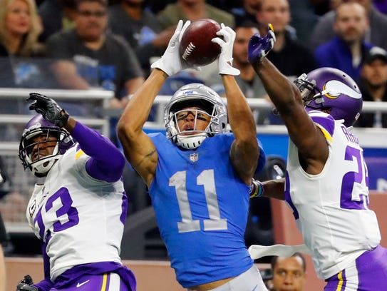 Marvin Jones, guarded by Vikings cornerbacks Terence Newman (23) and Xavier Rhodes, catches a 43-yard touchdown in the second half on Nov. 23.