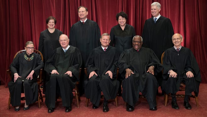 The justices of the U.S. Supreme Court gather for an official group portrait to include new Associate Justice Neil Gorsuch (top row, far right) on Thursday. June 1, 2017, at the Supreme Court Building in Washington. Seated (front row, from left) are Associate Justice Ruth Bader Ginsburg, Associate Justice Anthony M. Kennedy, Chief Justice of the United States John Roberts, Associate Justice Clarence Thomas, and Associate Justice Stephen Breyer. Back row, standing (from left) are Associate Justice Elena Kagan, Associate Justice Samuel Alito Jr., Associate Justice Sonia Sotomayor, and Associate Justice Neil Gorsuch.
