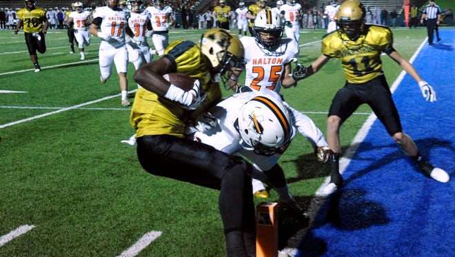 Abilene High School wide receiver Raekwon Millsap is tackled at the goal line Friday in the Eagles' homecoming game against Haltom High School. The run was ruled a touchdown, but Abilene High lost, 36-35.