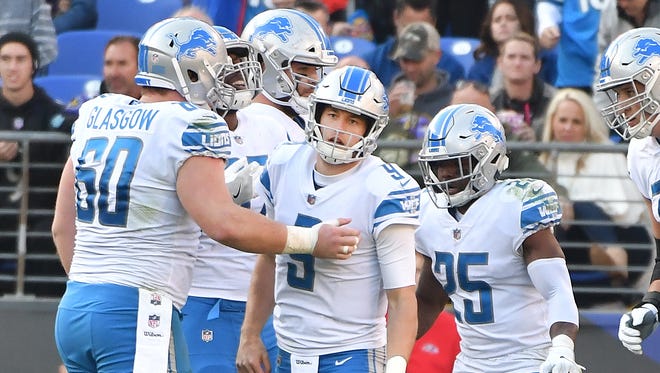 Lions' Matthew Stafford is helped by his offensive linemen after being sacked by the Ravens' Terrell Suggs in the second  quarter on Sunday in Baltimore.