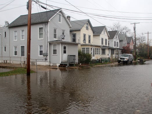 Floodwaters threaten homes along Herman Street in South
