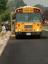 A student gets off of the school bus in her West Chester neighborhood Wednesday afternoon September 14, 2005.