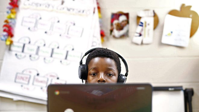 Elijah Bonsu, 10, a fifth-grader at Harmon Middle School in the Pickerington school district, works on his Chromebook in 2018. As they plan for the 2020-21 school year, some central Ohio schools are considering online learning options for students, in addition to in-person instruction.