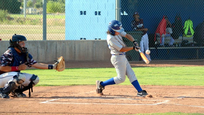 Carlsbad's Tyson Cisneros makes contact at the plate in the top of the second inning Saturday against Deming.