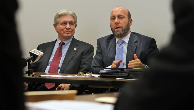Attorney Gary Welsh, right, addresses commissioners during a 2012 Marion County election commission meeting.   He represented Greg Wright, left, who alleged Sen. Richard Lugar and his wife, Charlene, are ineligible to vote in Marion County because they have not lived at the home address on their registration for more than three decades.