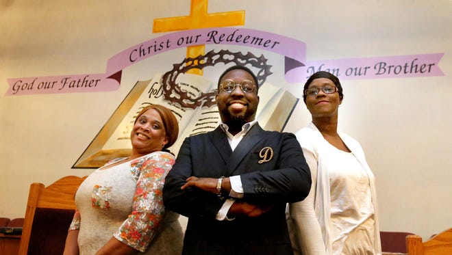 Christ Fellowship Chorale founder Darryl L. Chaney, center, is joined by two choir members, Connie Malone, Kendra Chaney, left, and Connie Malone. The chorale is celebrating 20 years in Murfreesboro.