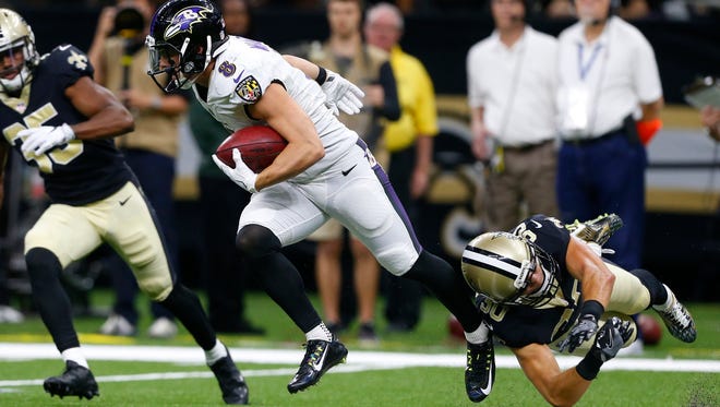 Baltimore Ravens wide receiver Griff Whalen (8) escapes the from the grip of New Orleans Saints defensive back Erik Harris (30) during a preseason game. Harris, who was waived by the Saints, signed with the Oakland Raiders on Sept. 5.