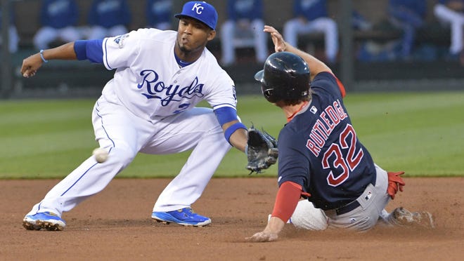 May 18, 2016; Kansas City, MO, USA; Boston Red Sox third baseman Josh Rutledge (32) steals second ahead of the tag by Kansas City Royals shortstop Alcides Escobar (2) in the fourth inning at Kauffman Stadium. After a review Rutledge was ruled safe. Mandatory Credit: Denny Medley-USA TODAY Sports