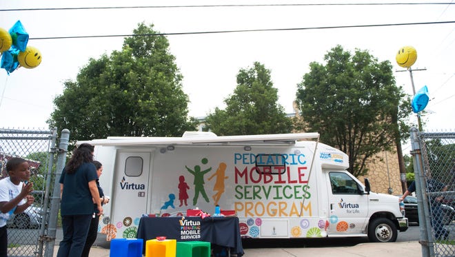 Virtua's Pediatric Mobile Services Program unit is stationed in front of the Anna M. Sample House in Camden on Wednesday, June 27, 2018.  