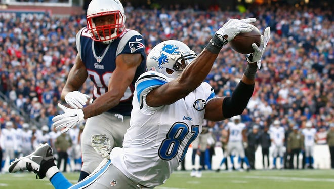 Calvin Johnson #81 of the Detroit Lions makes a diving catch for a first down as Brandon Browner #39 of the New England Patriots defends during the third quarter at Gillette Stadium on November 23, 2014 in Foxboro, Massachusetts.