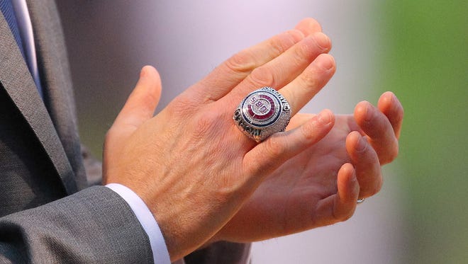 Apr 12, 2017; Chicago, IL, USA; The 2016 World Series championship ring on the hand of Chicago Cubs president of business operations Crane Kenney before the game against the Los Angeles Dodgers at Wrigley Field. Mandatory Credit: Dennis Wierzbicki-USA TODAY Sports