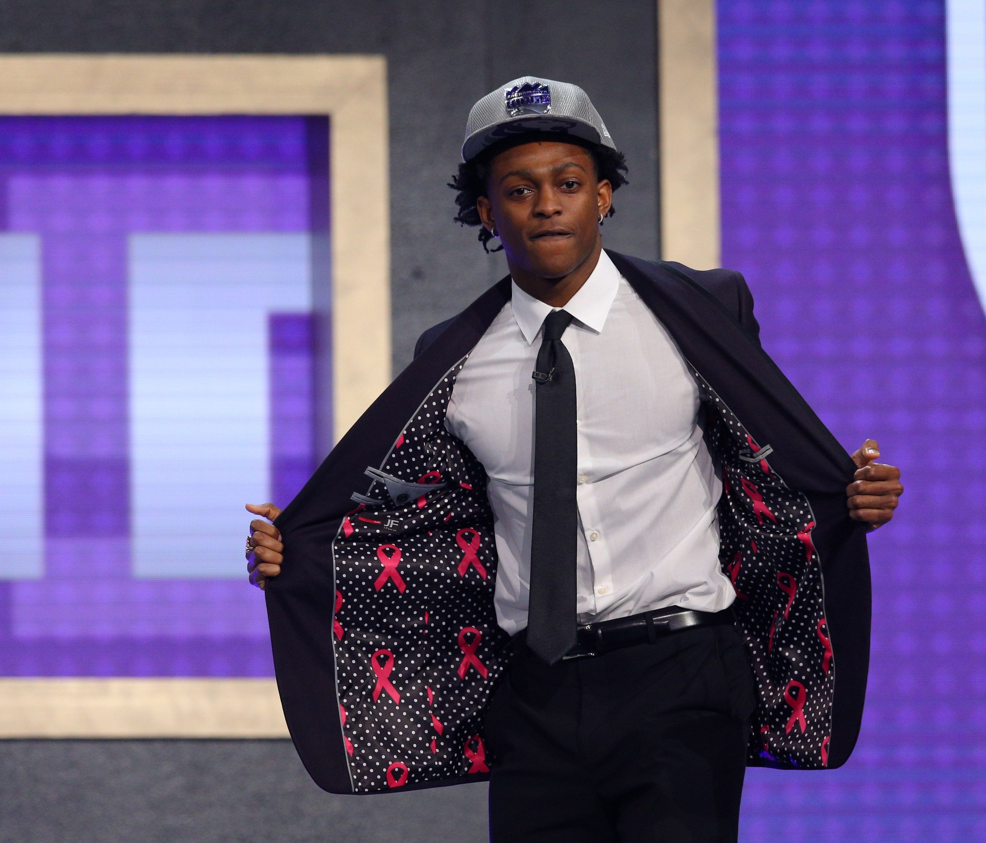 De'Aaron Fox (Kentucky) shows off the inside of his suit after being introduced as the number five overall pick to the Sacramento Kings in the first round of the 2017 NBA Draft at Barclays Center.