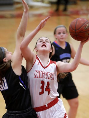 Kimberly High School's #34 Maddy Schreiber against Oshkosh West High School's #50 Kendra Davis during their WIAA  Division 1 regional semifinal girls basketball game on Friday, February 23, 2018, in Kimberly, Wis. Kimberly defeated Oshkosh West 55 to 36.Wm. Glasheen/USA TODAY NETWORK-Wisconsin