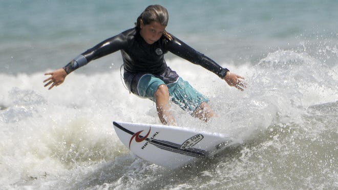 Aiden Adams surfs at Lori Wilson Park.