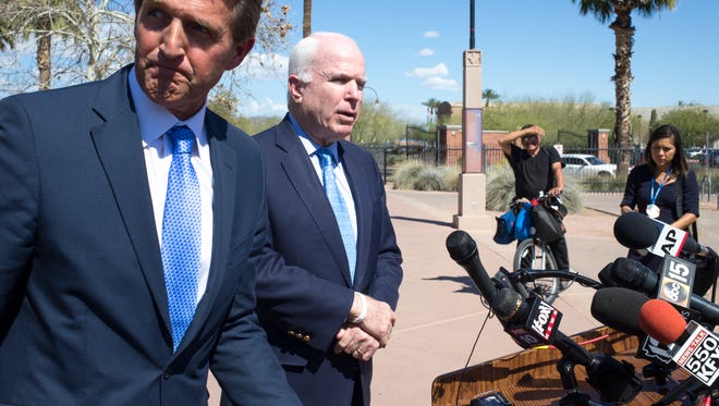 U.S. Sens. John McCain (right) and Jeff Flake, both Arizona Republicans, split over a letter that 47 Republicans sent to Iranian leaders. McCain signed the letter, but Flake didn't, saying that it was not appropriate.
