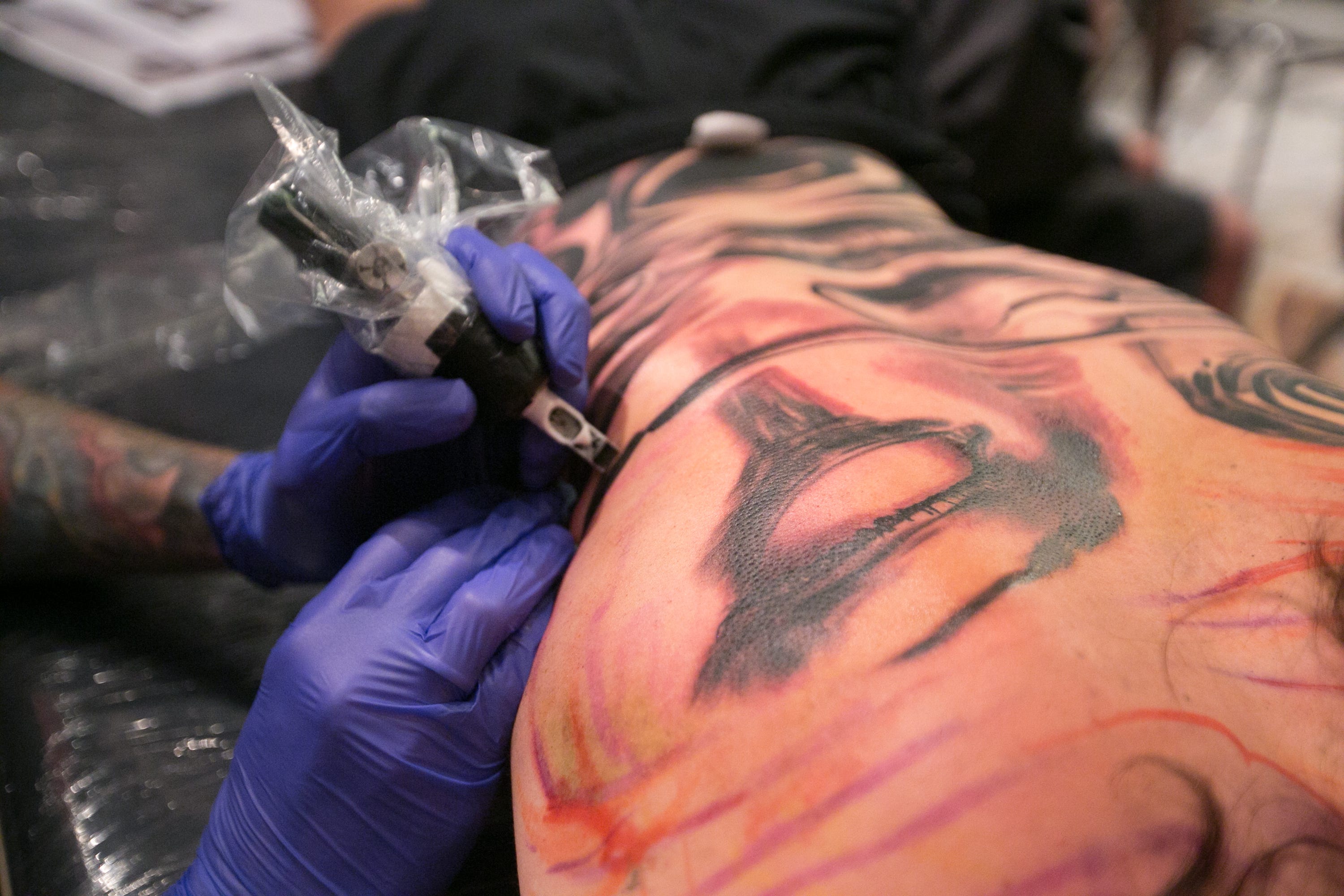 Man getting back tattoo at Tattoo Expo  Man getting back ta  Flickr