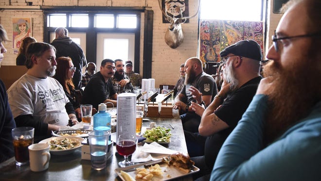 The Old Dog Whisker Club meets during its first meeting of the year at the Old Dog Tavern in Kalamazoo. The members grow their beards and mustaches for national competitions.