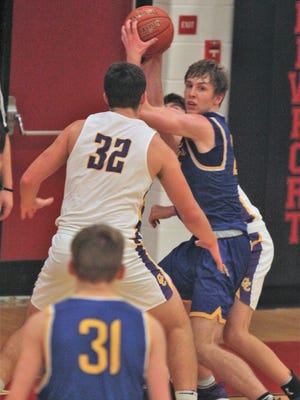 NCC junior Evan Mullikin looks for an opening against Campbell County senior Tanner Lawrence during Campbell County's 72-54 win over Newport Central Catholic in boys basketball Dec. 15, 2018 as part of the John Turner Classic at Newport HS.