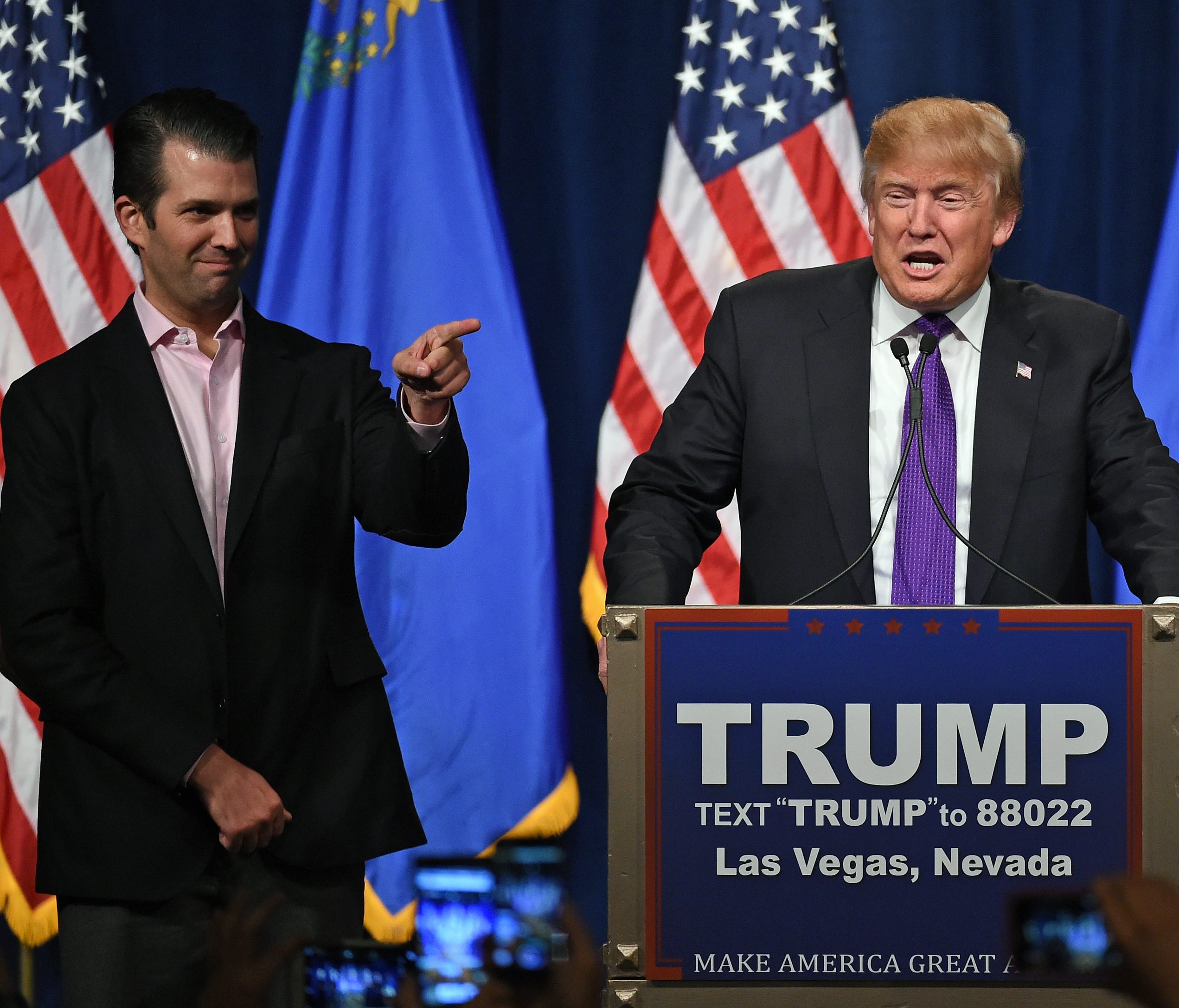 Donald Trump Jr. looks on as his father speaks at a caucus night watch party on Feb. 23, 2016, in Las Vegas.