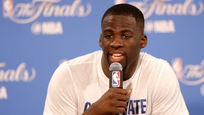 Draymond Green #23 of the Golden State Warriors speaks to members of the media after being defeated by the Cleveland Cavaliers in Game 7 of the 2016 NBA Finals at ORACLE Arena on June 19, 2016 in Oakland, California.