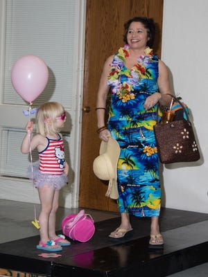 Robin Fraser, right, and her 3-year-old granddaughter, Lizzy Fraser, model beachwear during the second annual Spring Fashion Show and Luncheon at St. Anne's Episcopal Church in De Pere on Saturday, April 9, 2016.