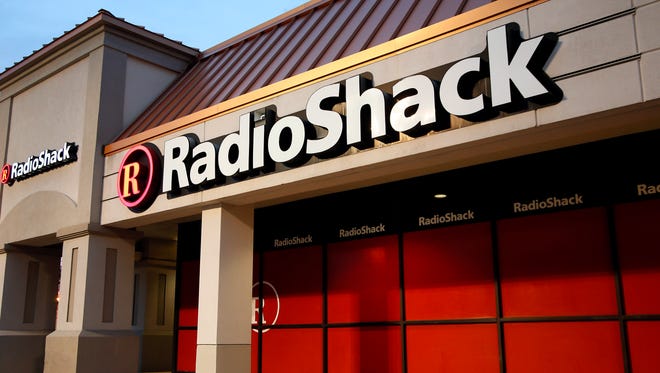 This Tuesday, Feb. 3, 2015 photo shows a RadioShack store in Dallas. The company that introduced the first mass-market personal computer, is fading after years of heavy losses and the suspension of its shares. (AP Photo/Tony Gutierrez)