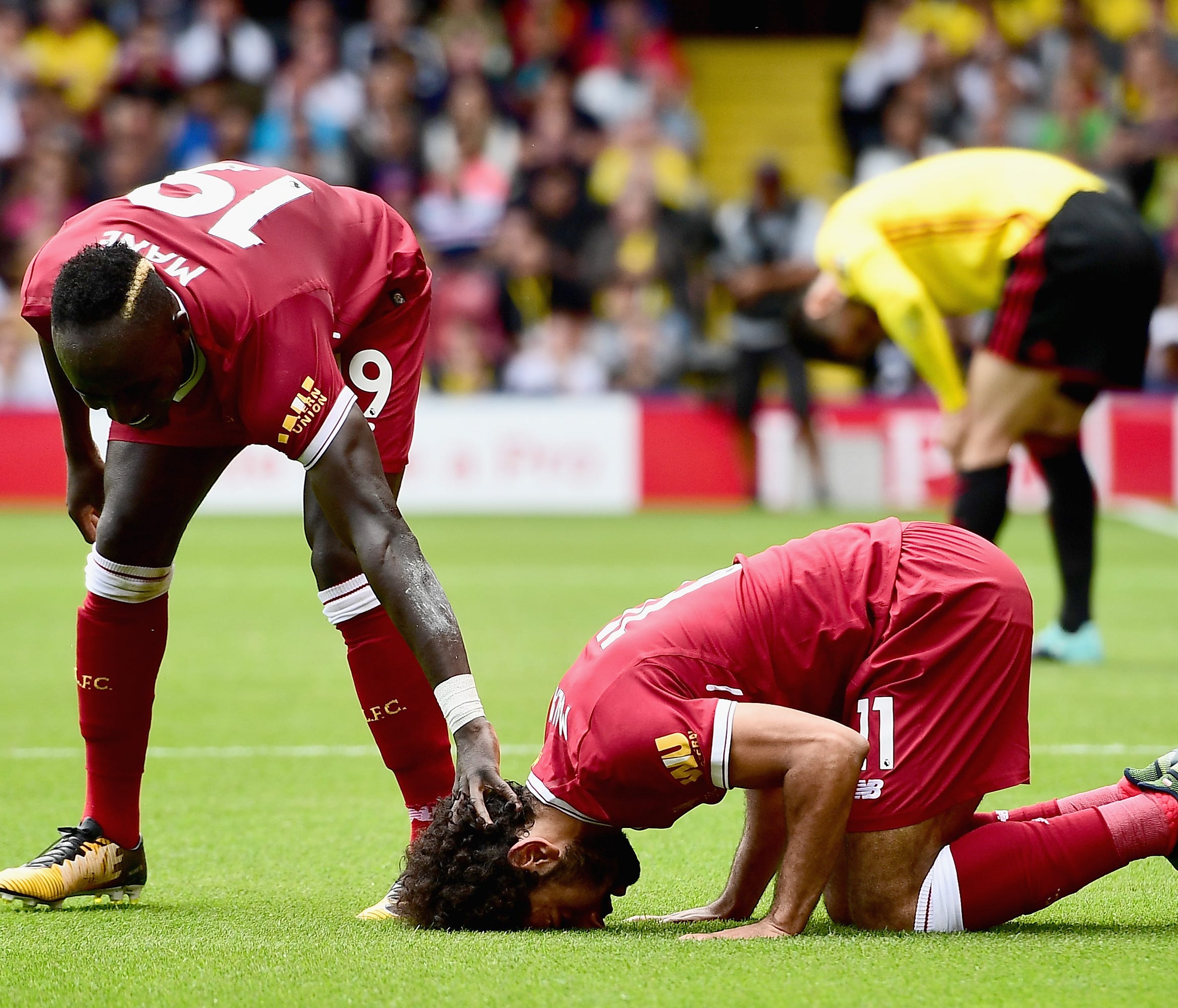 WATFORD, ENGLAND - AUGUST 12: Mohamed Salah of Liverpool celebrates scoring his sides third goal with Sadio Mane of Liverpool during the Premier League match between Watford and Liverpool at Vicarage Road on August 12, 2017 in Watford, England.  (Pho