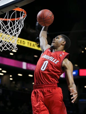 U of L’s V.J. King (0) flew in for a dunk against FSU during the ACC Tournament in Brooklyn, NY.  U of L won 82-74.    Mar. 7, 2018