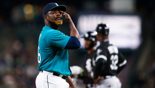 Seattle Mariners pitcher Fernando Rodney walks back to the dugout after being relieved from a game against the Chicago White Sox.