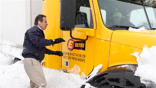 New York Gov. Andrew Cuomo checks on a snowbound trucker in Cheektowaga, N.Y., Wednesday, Nov. 19, 2014.
