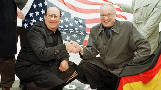 FILE - In this Oct. 1, 1998 file photo, Elvis Presley's former road manager and friend Joe Esposito, left, shakes hands with Bremerhaven mayor Manfred Richter at the point Elvis stepped on German soil. The King of Rock n Roll came to Germany by ship as a soldier of the US Army.  Esposito's daughter Cindy Bahr said Tuesday, Nov. 29, 2016, that he had dementia and died Nov. 23 of natural causes in Calabasas, Calif. He was 78.