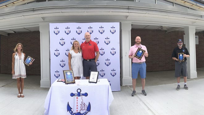 The Rhode Island Interscholastic Athletic Administrators Association held its annual ceremony outside of Middletown High School on Thursday. The honorees included, from left, Lisa Cecci (Female Coach of the Year), Katherine Cawley (state scholar essay winner), Jim Cawley (Athletic Director of the Year), Scott Barrett (Media Award) and Arthur Bell (Male Coach of the Year).