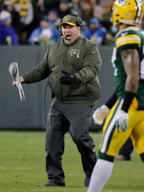 Green Bay Packers head coach Mike McCarthy shouts at