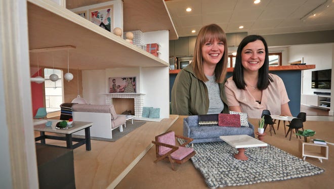 Liz Sutton, left, and Ashley Lee show one of the two dollhouses they designed, Tuesday, Feb. 20, 2018, to sell in the silent auction of the Gigi's Playhouse 2018 Gala, "I Have A Voice," a benefit for Gigi's Playhouse Down syndrome achievement centers.  The house at left was designed by Lee, and the pieces at right are from Sutton's dollhouse.