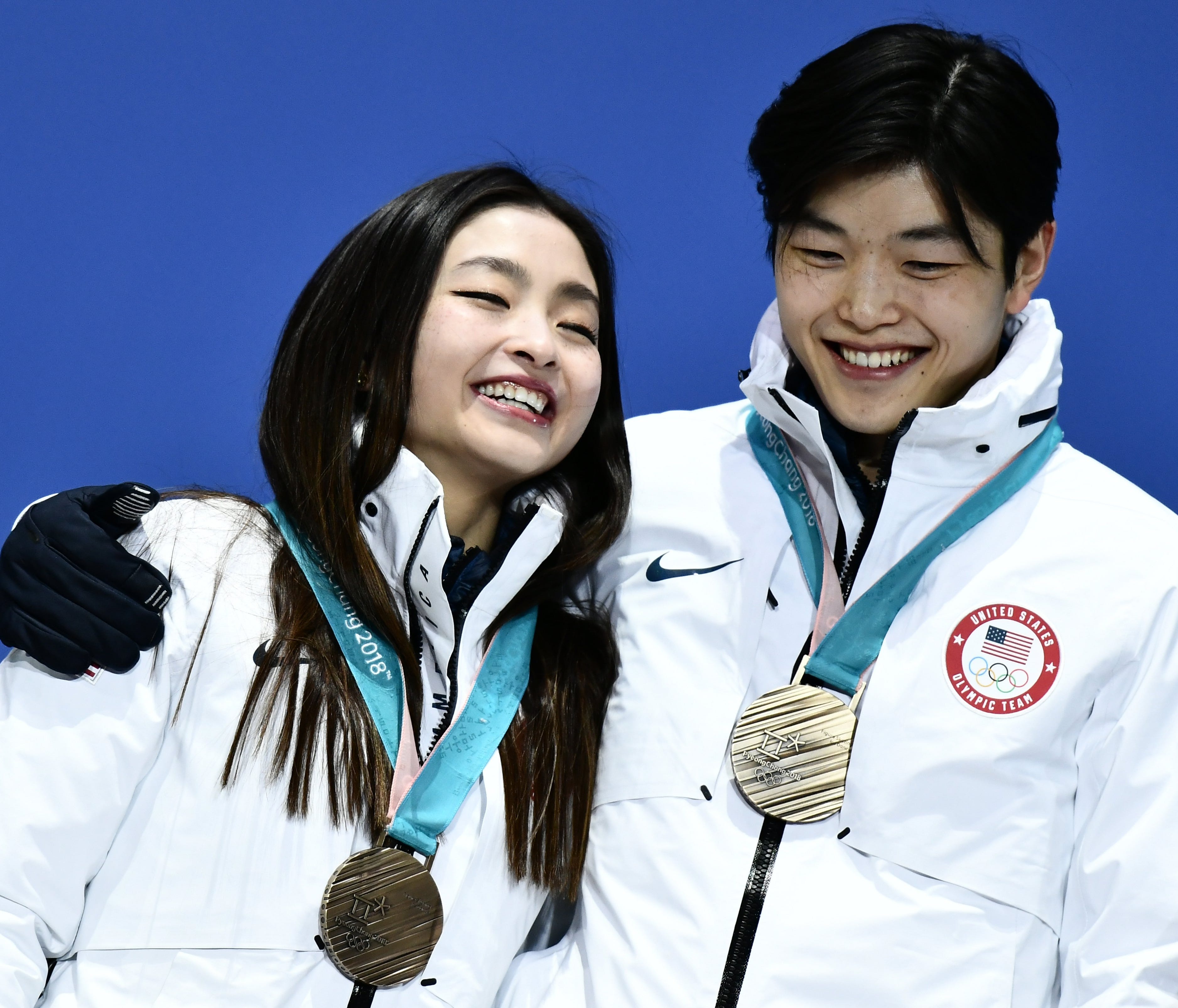epa06545773 Bronze winners Maia Shibutani and Alex Shibutani of the USA (R) during the medal ceremony for the Figure Skating Ice Dance event during the PyeongChang 2018 Olympic Games, South Korea, 18 February 2018.  EPA-EFE/CHRISTIAN BRUNA