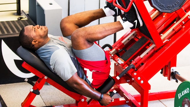 Defensive end Cory Redding works out at the Arizona Cardinals practice facility in Tempe on April 21, 2015.  The media was allowed in to observe players working out in the weight room.