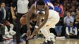 Philadelphia 76ers center Joel Embiid (21) fouls and