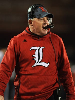 UofL head coach Bobby Petrino works the sideline as the Cardinals take on Florida State on Thursday at Papa John's Cardinal Stadium. (By David Lee Hartlage, Special to the C-J) Oct. 30, 2014.