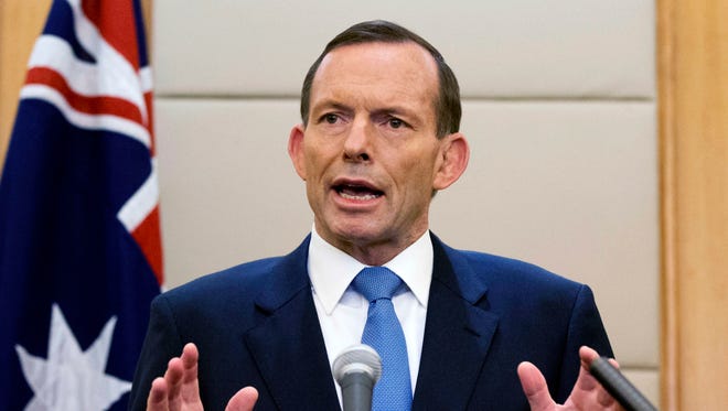 Australian Prime Minister Tony Abbott speaks during a press conference at a hotel in Beijing, China.