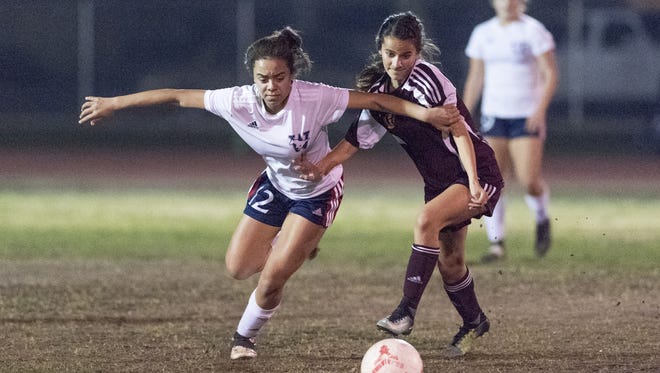 Tulare Western's Ana Porchia, left, battles for possesion against Tulare Union in an East Yosemite League high school girls soccer game on Wednesday, February 7, 2018.