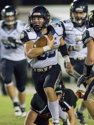 Gulf Breeze running back Ty Dittmer ran for 252 yards in a season-opening win over Pascagoula (Miss.) on Friday night in Gulf Breeze.