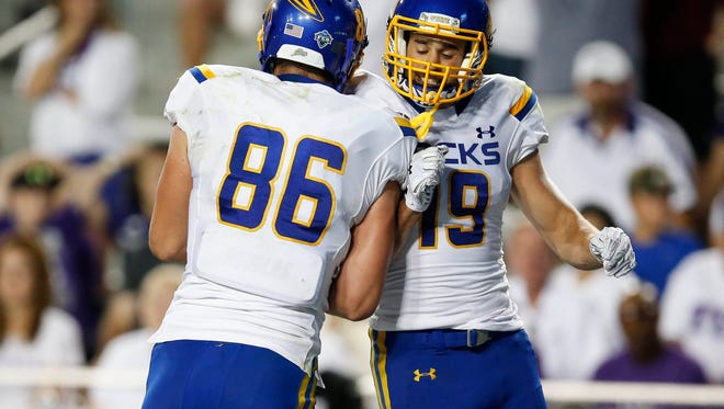 Sep 3, 2016; Fort Worth, TX, USA; South Dakota State Jackrabbits tight end Dallas Goedert (86) celebrates his touchdown with wide receiver Jake Wieneke (19) during the second half on an NCAA football game at Amon G. Carter Stadium. TCU won 59-41. Mandatory Credit: Jim Cowsert-USA TODAY Sports