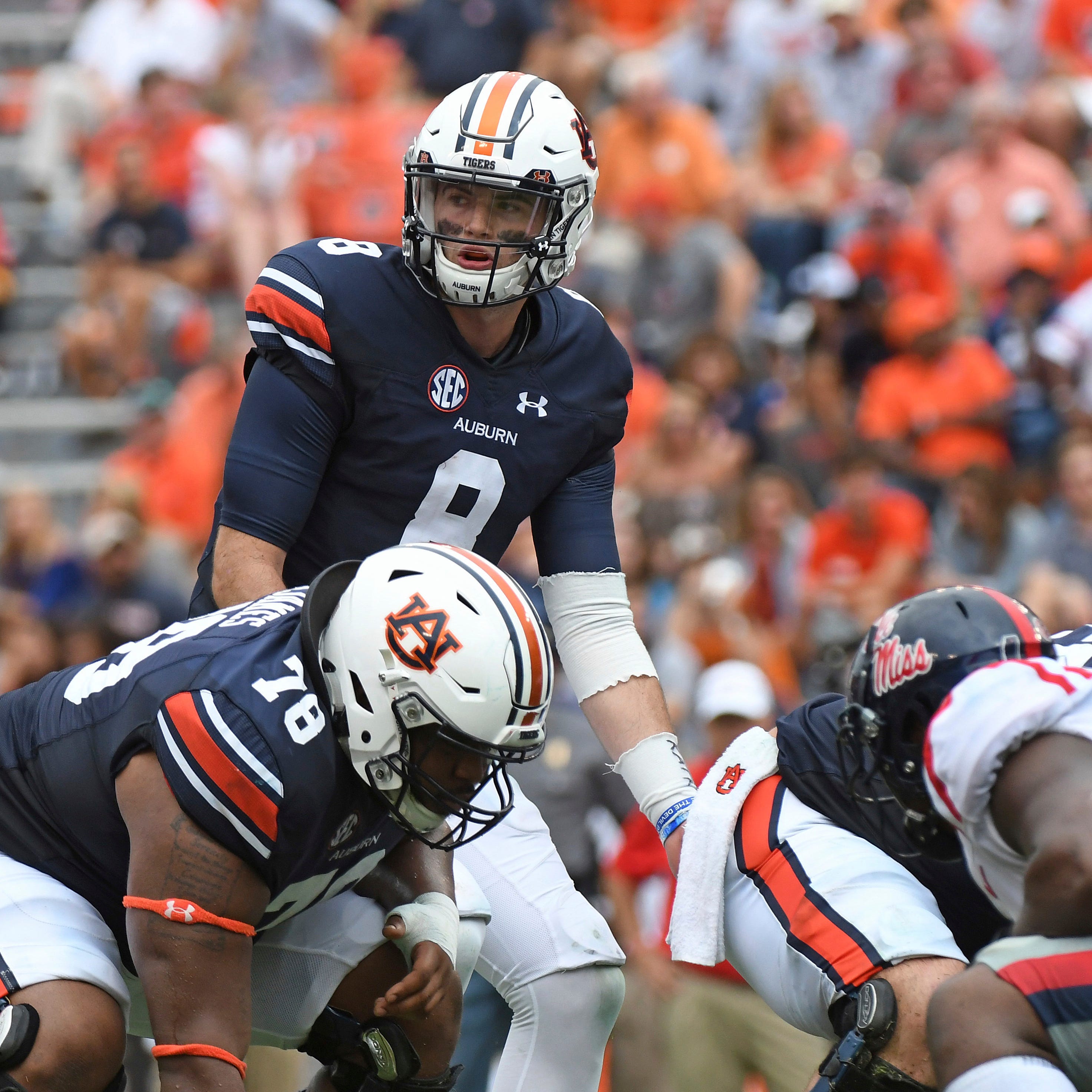 FILE - In this Oct. 7, 2017, file photo, Auburn quarterback Jarrett Stidham (8) looks to the sideline during the second half of an NCAA college football game against Mississippi, in Auburn, Ala. Last season scoring was down in college football, a dro
