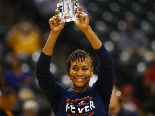 Indiana Fever forward Tamika Catchings (24) is awarded a WNBA sportsmanship award prior to facing off against the Phoenix Mercury at Bankers Life Fieldhouse on Sept. 21, 2016.