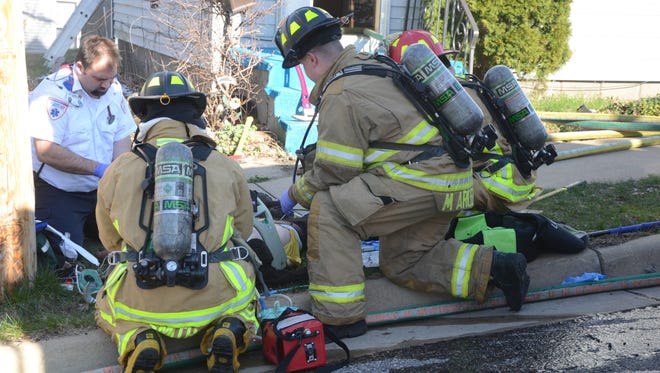 LifeCare paramedics and Battle Creek firefighters worked more than 30 minutes trying to revive a man pulled from a house fire.