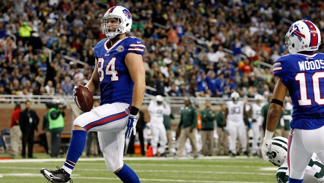 Buffalo Bills tight end Scott Chandler (84) scores a touchdown against the New York Jets during the first half at Ford Field. Bills beat the Jets 38-3.