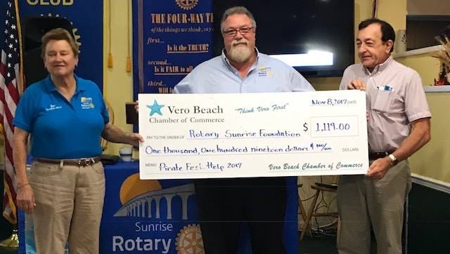 Sunrise Rotary Vero Beach Foundation Chair Jane Burton, left, club President Dr. Stephen Kepley and Vero Beach Chamber of Commerce Executive Director Bob McCabe with the $1,119 check from the chamber's annual Pirate Fest.
