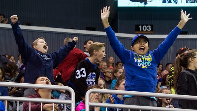 College View Middle School sixth-graders Hayden Browning (left to right), Hayden Hill and Harley Bravo cheer as the Evansville Thunderbolts defeat the Peoria Rivermen during Education Day at the Ford Center in Evansville, Ind., Tuesday, Oct. 24, 2017. The students took a field trip with their Davises County, Ky., school to see the Thunderbolts win, 4-2. 