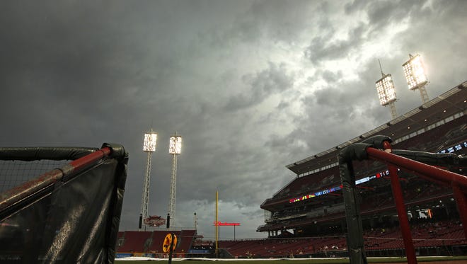 Dark clouds roll over the field during a rain delay prior to Monday night's game.
