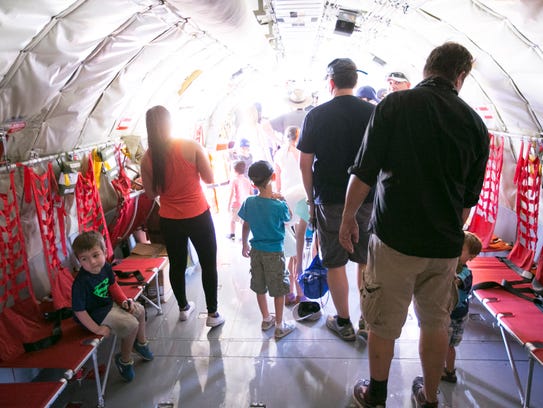 People tour the inside of a KC-135R Stratotanker military